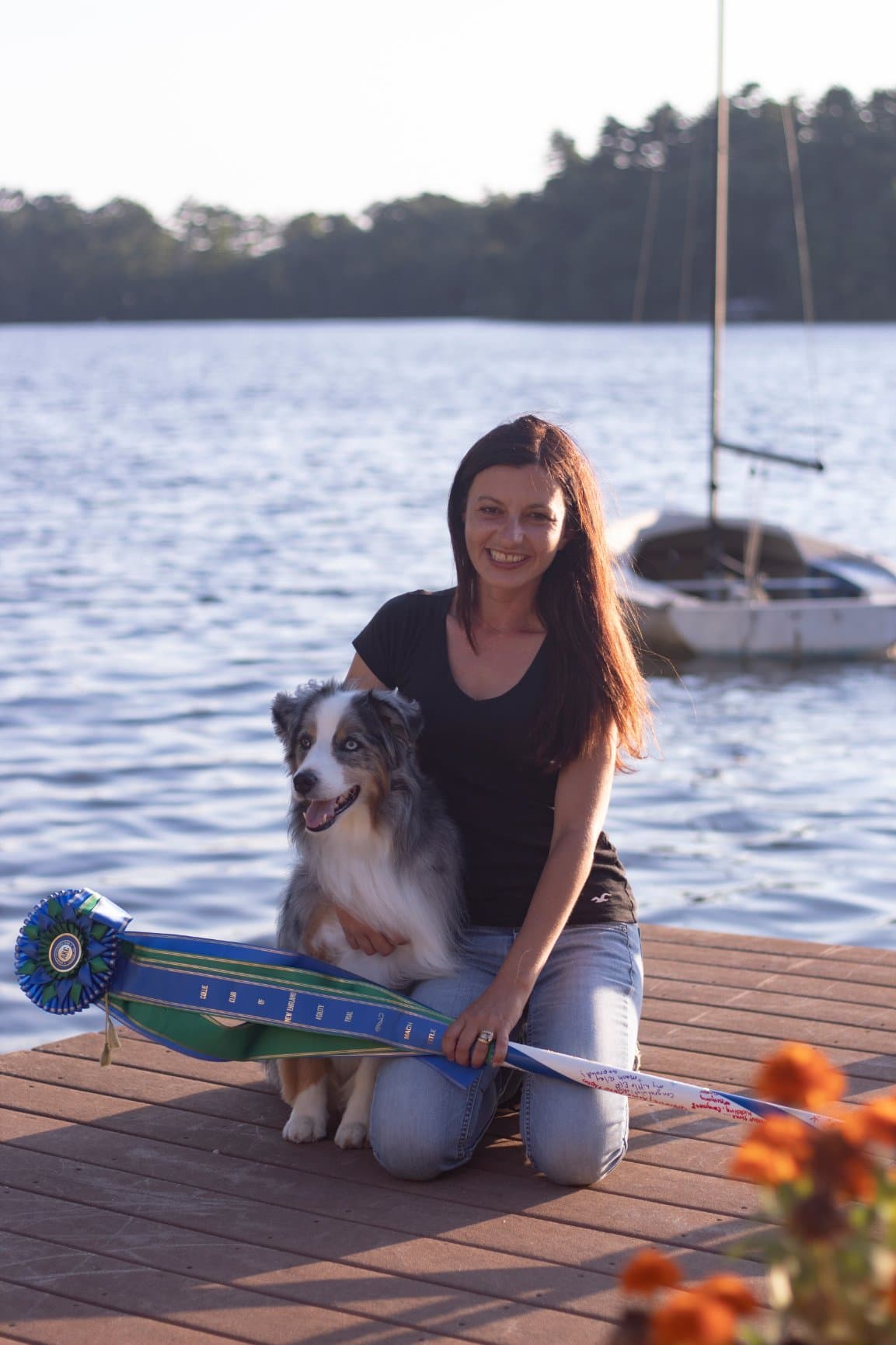 Agility Playhouse trainer with her dog and agility ribbons